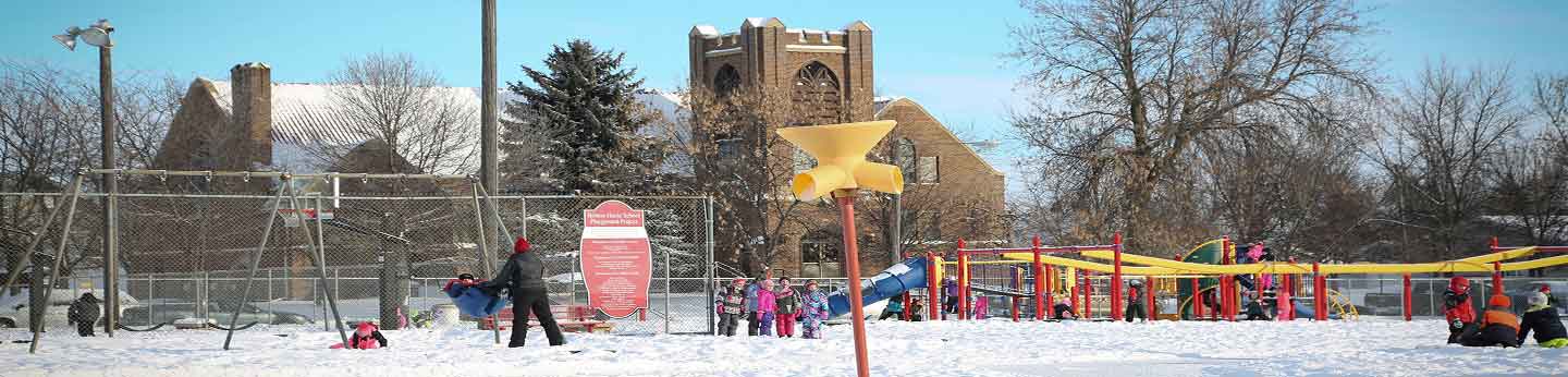 Children playing on a playground in the winter
